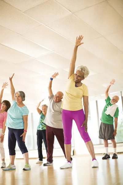 Group exercise class stretching