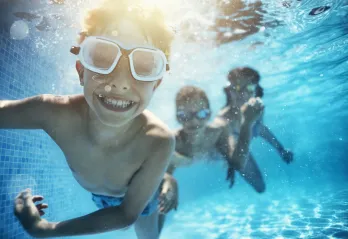 children swimming underwater