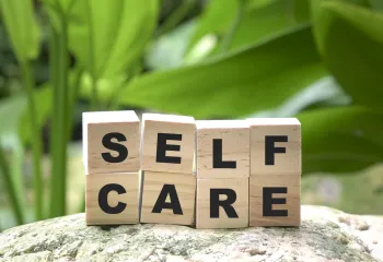 self care spelled out in wooden blocks 