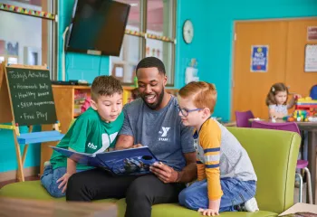 Y Staff Reading to Kids
