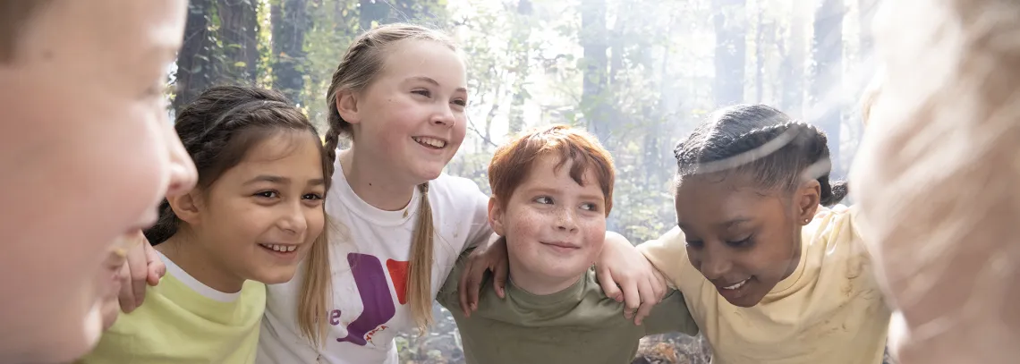 Kids Huddle in the Forest