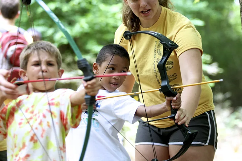 2 boys practicing Archery
