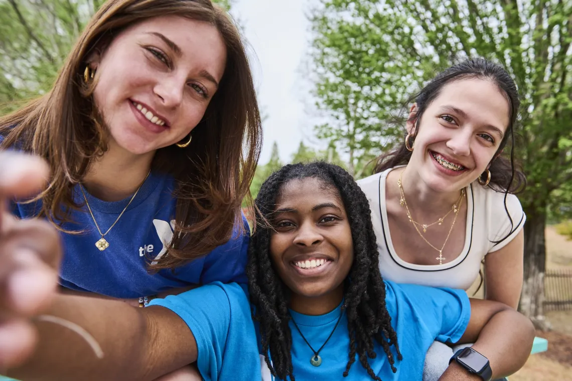 Group of teens taking a selfie and smiling