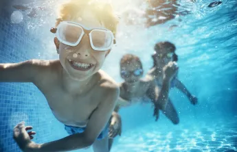 children swimming underwater