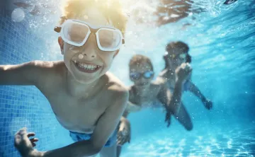 children swimming underwater