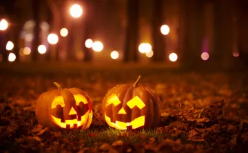 two smiling carved pumpkins